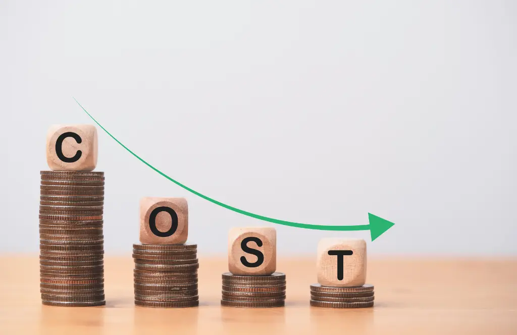 Cost wording on decreasing coins stacking with down arrow for cost reduction concept which effect to product cost profit inflation and economy recession concept