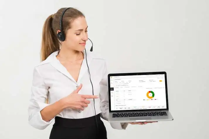 A girl standing and displaying a call tracking software dashboard on a laptop