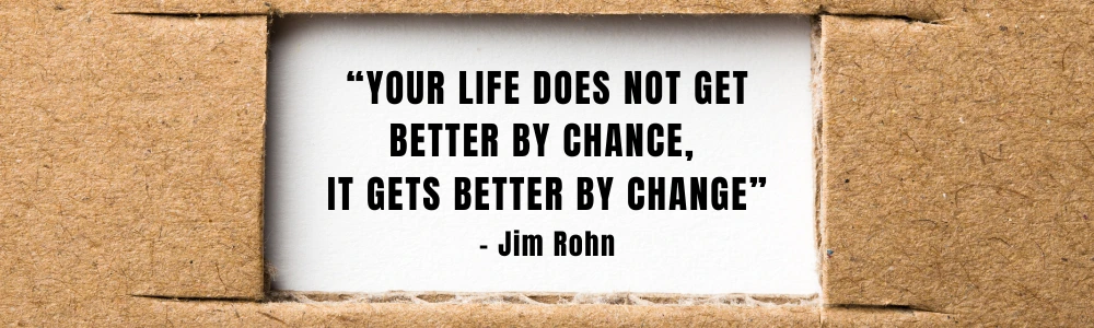 A quote by Jim Rohn on a cardboard background reads: Your life does not get better by chance, it gets better by change